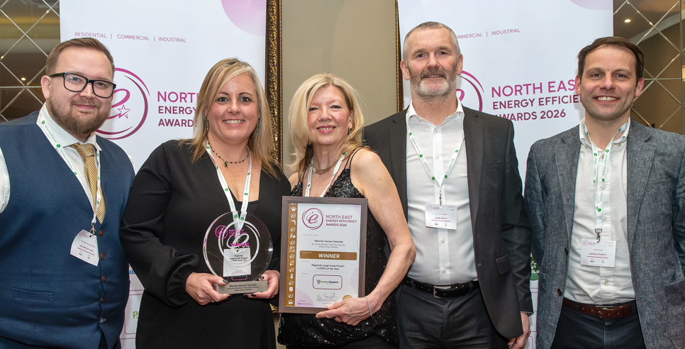 Group photo featuring North Star's trophy and certificate 